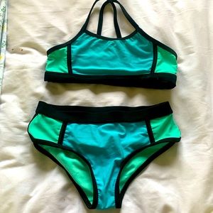 Target two piece suit- blue, & teal- size 7/8- straps cross in the back